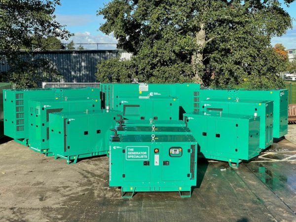 Several green generators at a specified location in order to complete an emergency generator service job.
