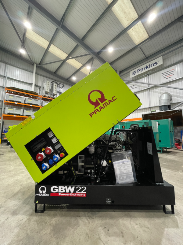 A lime green, black and red Pramac GBW-22 power generator.
